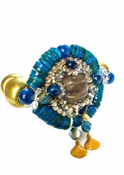 Ocean Radiance Blue Chrysocolla, Agate, Lapis Lazuli, Faceted Glass and Sodalite Stone, Brass Statement Bracelet with Shell
Charms